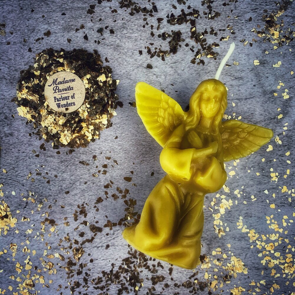 Orange beeswax angel spell candle by Parlour of Wonders for connecting with spirit guides and divine blessings.