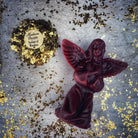 Orange beeswax angel spell candle by Parlour of Wonders, featuring detailed angel design for connecting with spirit guides and divine blessings.