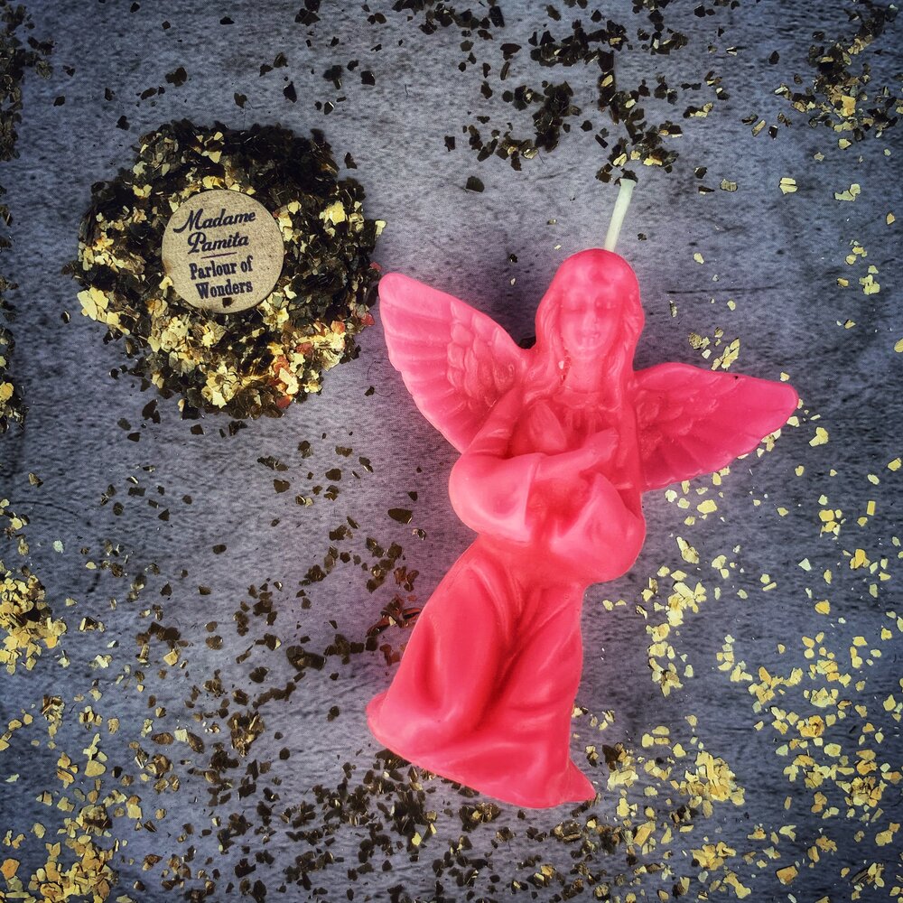 Orange beeswax angel spell candle from Parlour of Wonders for connecting with spirit guides and divine blessings.