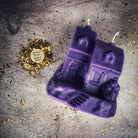 Orange beeswax candle from Parlour of Wonders with a Happy House spell for home protection, harmony, and blessings.
