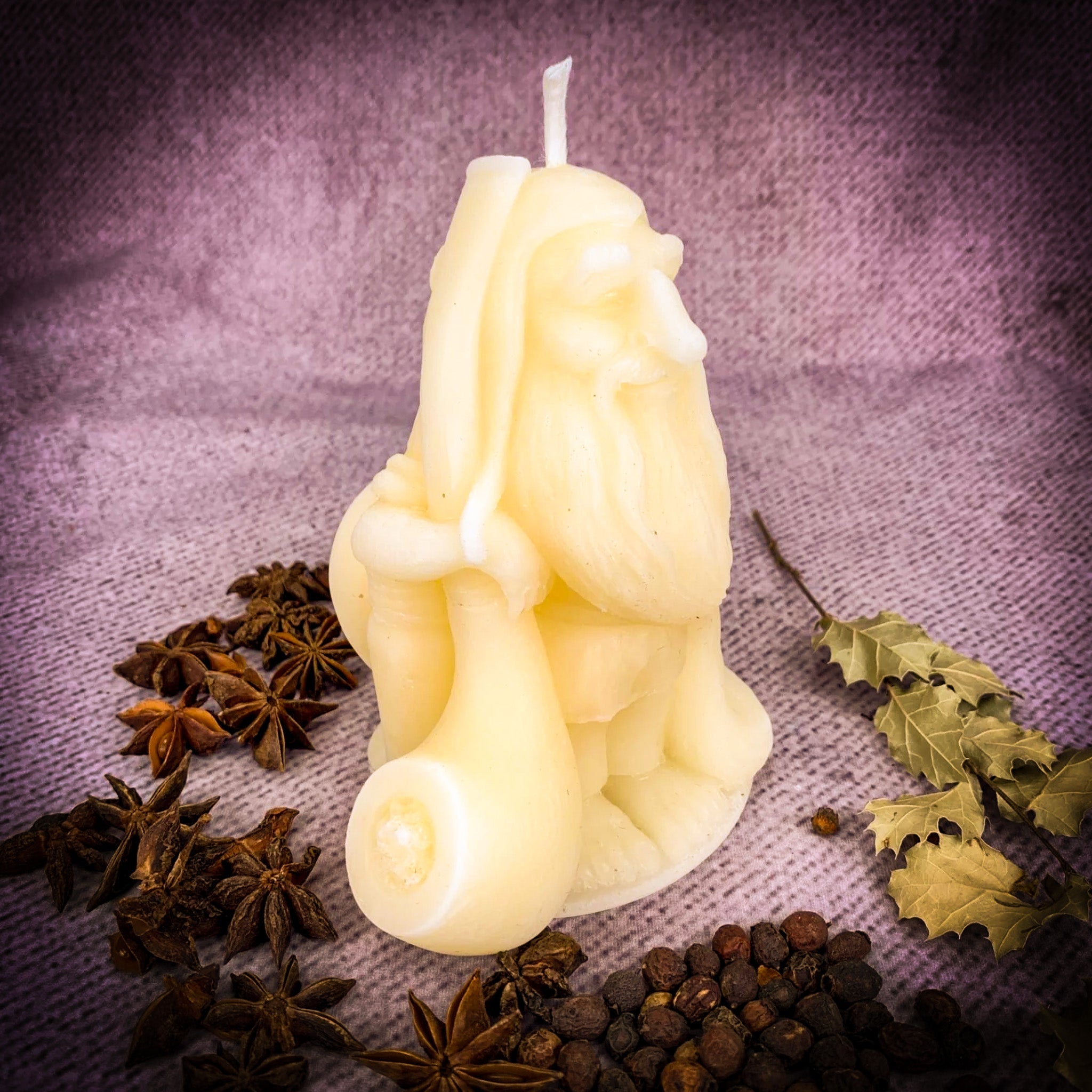 Orange beeswax Domovyk gnome spell candle by Parlour of Wonders for home blessing and protection, featuring a detailed gnome figure.