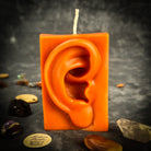 Beeswax Ex-Voto Ear Spell Candle by Parlour of Wonders, orange beeswax candle for healing, being heard, and clairaudience.