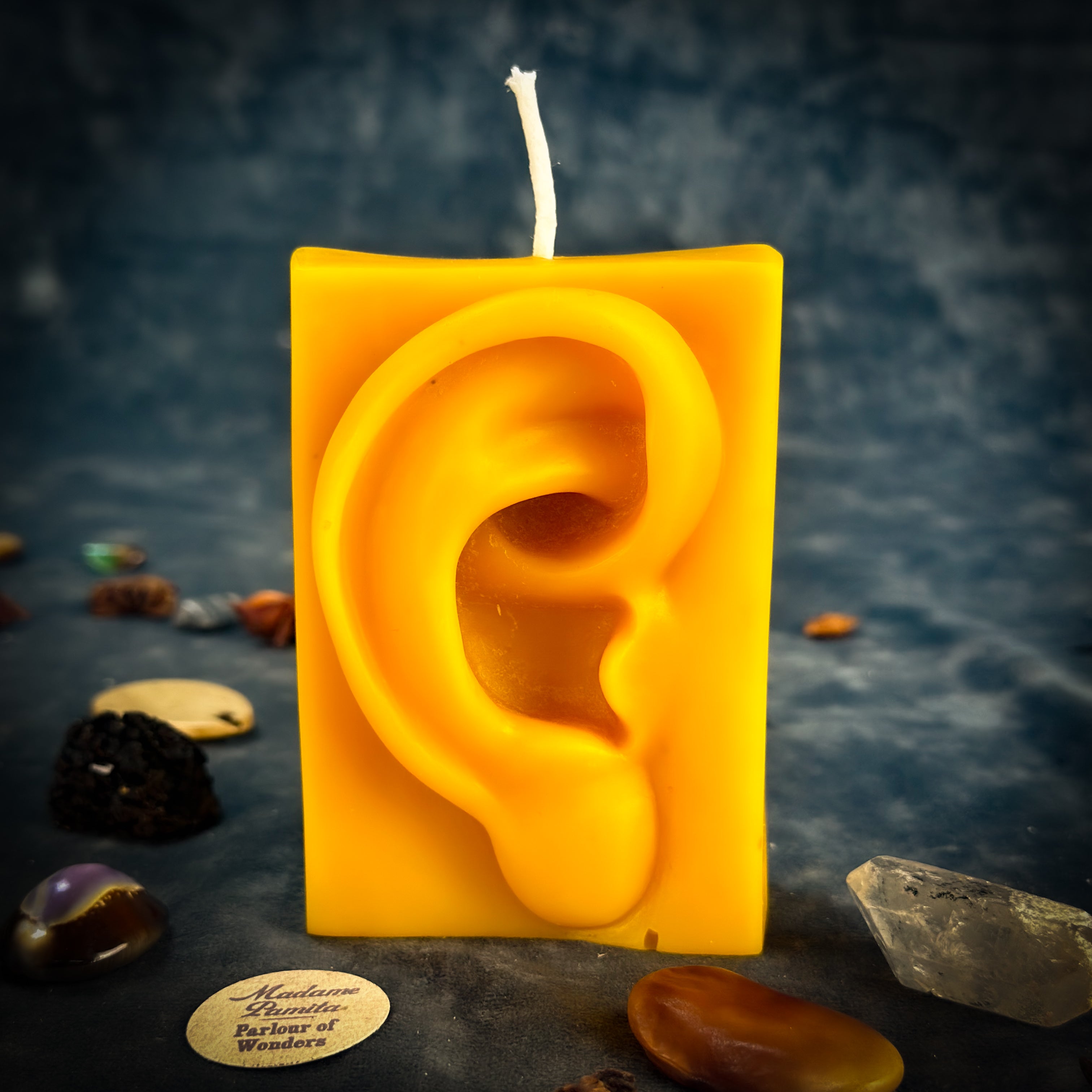 Beeswax Ex-Voto Ear Spell Candle by Parlour of Wonders, orange beeswax candle for healing, being heard, and clairaudience.
