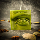 Beeswax Ex-Voto Eye Spell Candle by Parlour of Wonders, orange beeswax candle for vision, clairvoyance, and being seen, with eye design.