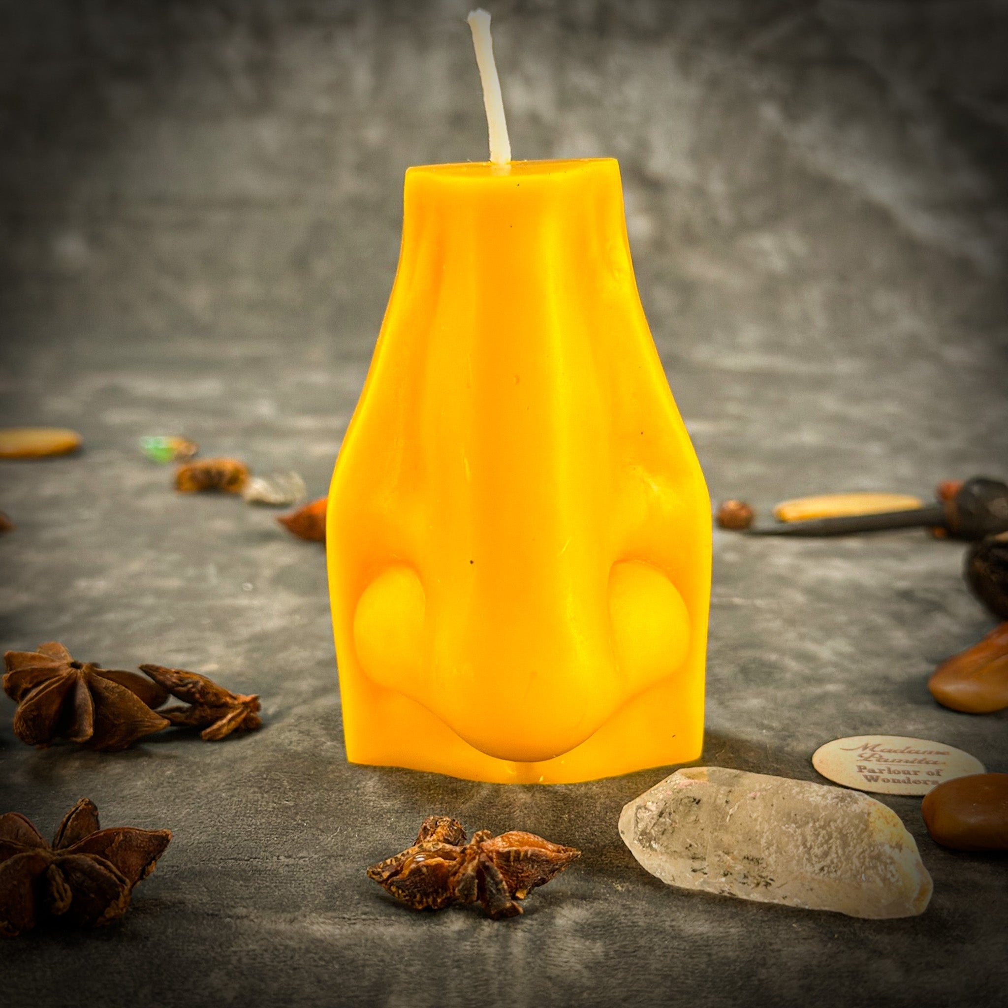 Beeswax Ex-Voto Nose Spell Candle by Parlour of Wonders with orange wax, used for clairalience, intuition, and healing rituals.
