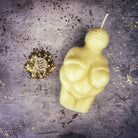 Orange beeswax Goddess of Willendorf spell candle with feminine power and fertility symbolism, designed for magic and ritual use.