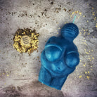 Beeswax Goddess of Willendorf spell candle by Parlour of Wonders, orange-colored, feminine power and fertility magic candle.