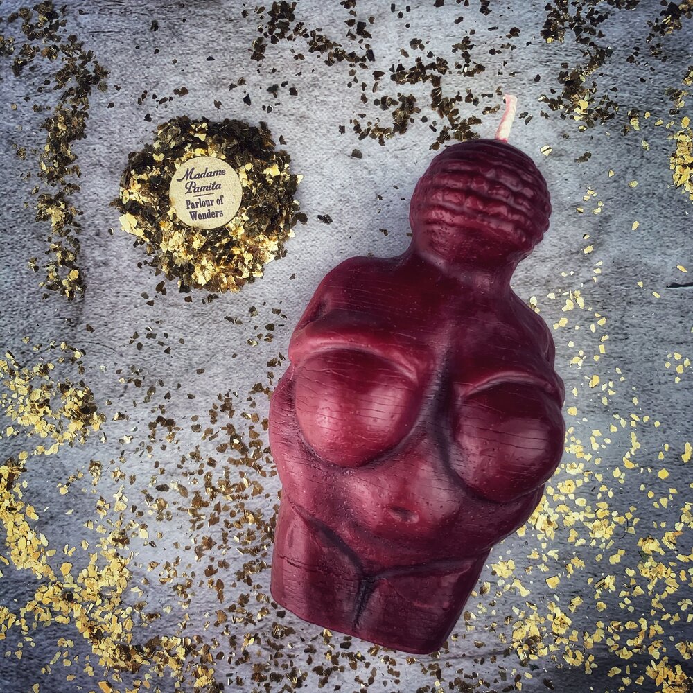 Beeswax Goddess of Willendorf spell candle by Parlour of Wonders, featuring an orange design representing feminine power and fertility magic.