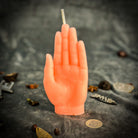 Beeswax Hand of Fate spell candle by Parlour of Wonders with orange wax for destiny, transformation, and divine timing.
