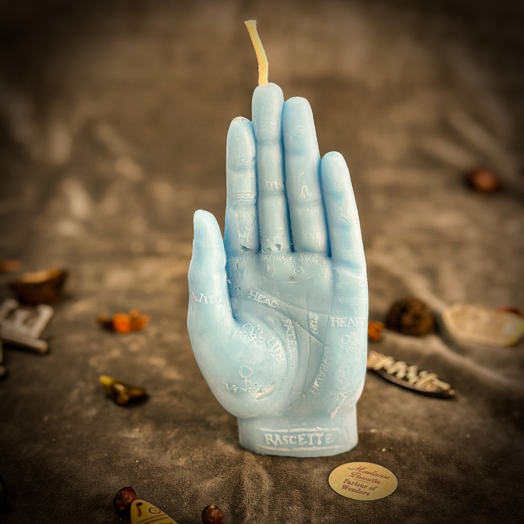 Orange beeswax hand of fate spell candle by Parlour of Wonders, featuring intricate design for destiny and transformation.