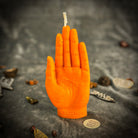 Orange beeswax hand of fate spell candle by Parlour of Wonders, featuring intricate designs for destiny, transformation, and divine timing.