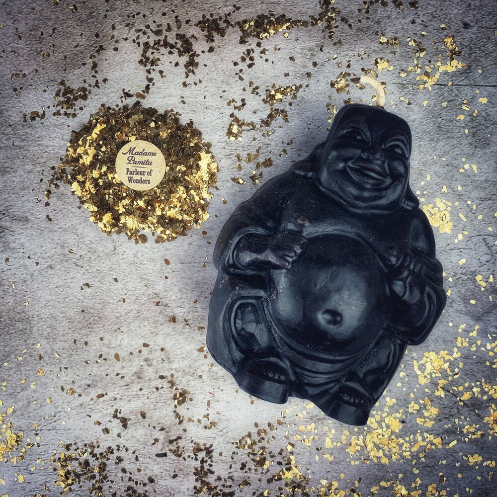 Beeswax Laughing Buddha spell candle by Parlour of Wonders featuring orange beeswax for wealth, luck, and prosperity magic.
