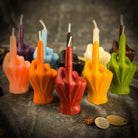 Beeswax middle finger spell candle by Parlour of Wonders, orange wax for banishing, boundaries, and empowerment.