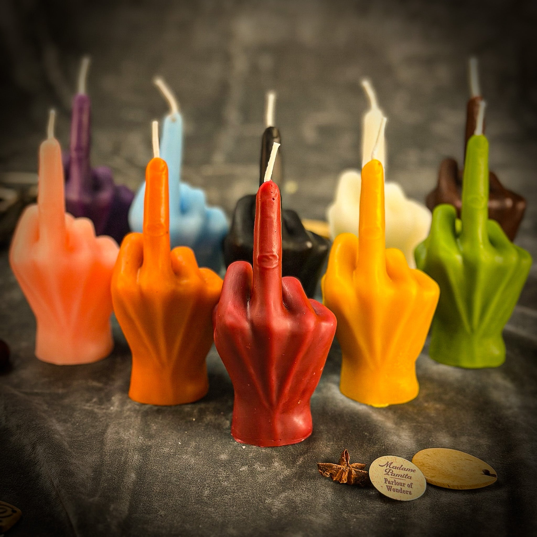 Beeswax middle finger spell candle by Parlour of Wonders, orange wax for banishing, boundaries, and empowerment.