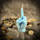 Beeswax middle finger spell candle by Parlour of Wonders, used for banishing, boundaries, and empowerment rituals.
