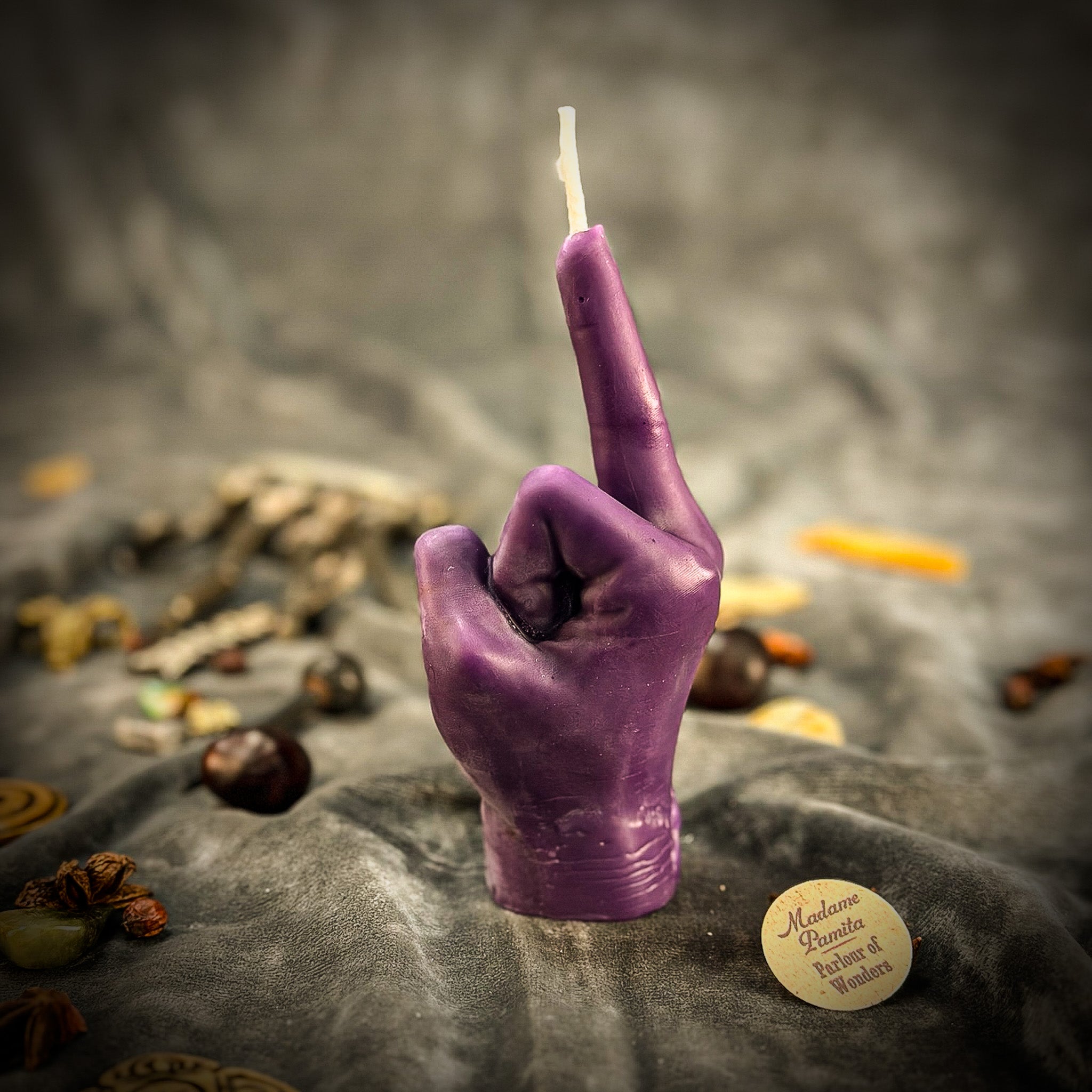Beeswax Middle Finger Spell Candle by Parlour of Wonders with orange wax for banishing, boundaries, and empowerment.