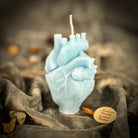 Pink beeswax anatomical heart candle by Parlour of Wonders, designed for love and emotional healing magic.