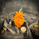 Pink beeswax anatomical heart candle by Parlour of Wonders, designed for love and emotional healing magic.