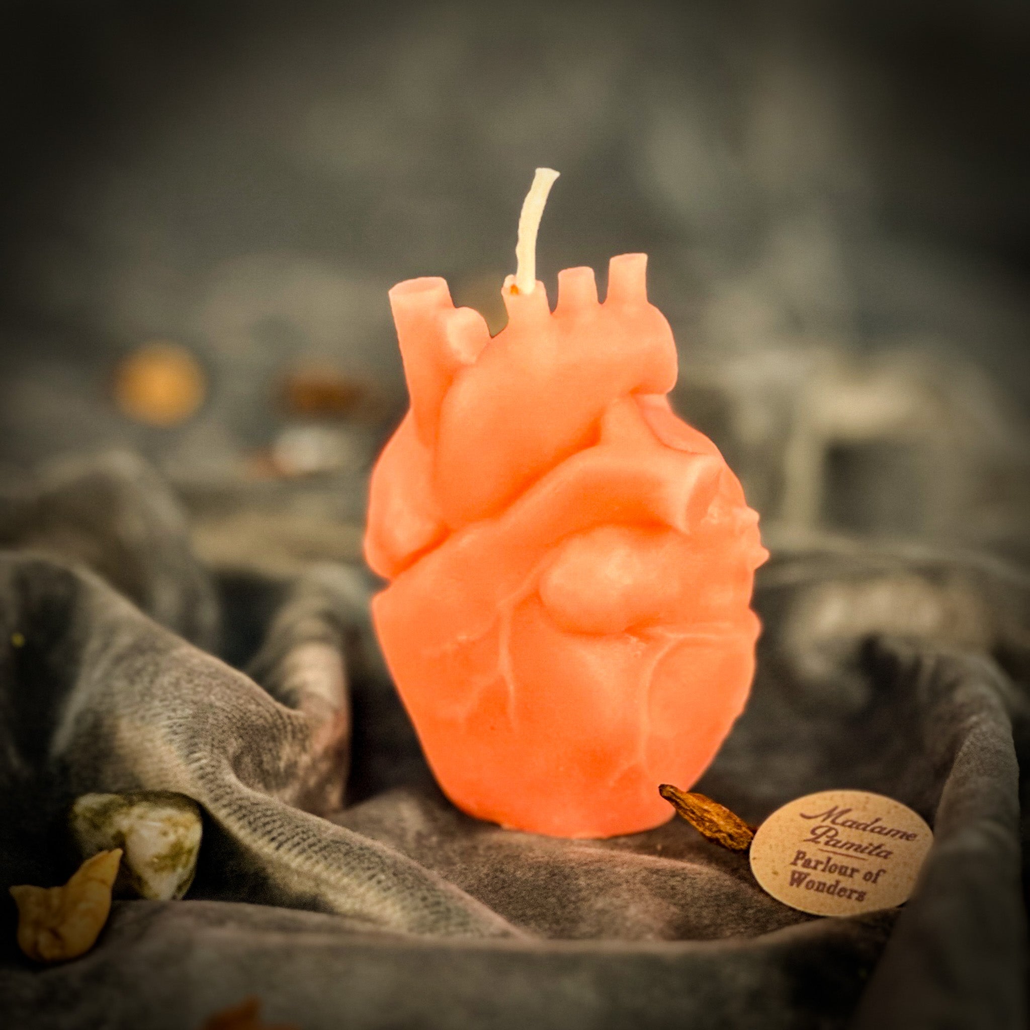 Pink beeswax anatomical heart candle from Parlour of Wonders, designed for love and emotional healing magic.