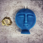 Pink beeswax candle with carved design, used for ancestral guidance and protection magic, from Parlour of Wonders.
