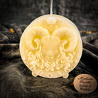 Pink beeswax Aries Ram zodiac spell candle by Parlour of Wonders, featuring detailed zodiac symbols for courage, passion, and victory.