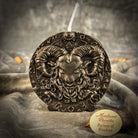 Pink beeswax Aries Ram zodiac spell candle with flame, symbolizing courage, passion, and victory, by Parlour of Wonders