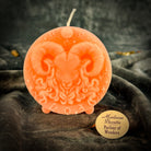 Pink beeswax Aries Ram zodiac spell candle by Parlour of Wonders with symbols representing courage, passion, and victory.