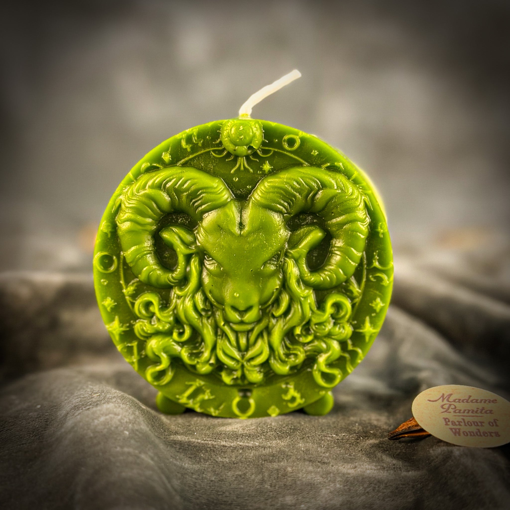Pink beeswax Aries Ram zodiac spell candle by Parlour of Wonders, featuring detailed ram design for courage, passion, and victory.