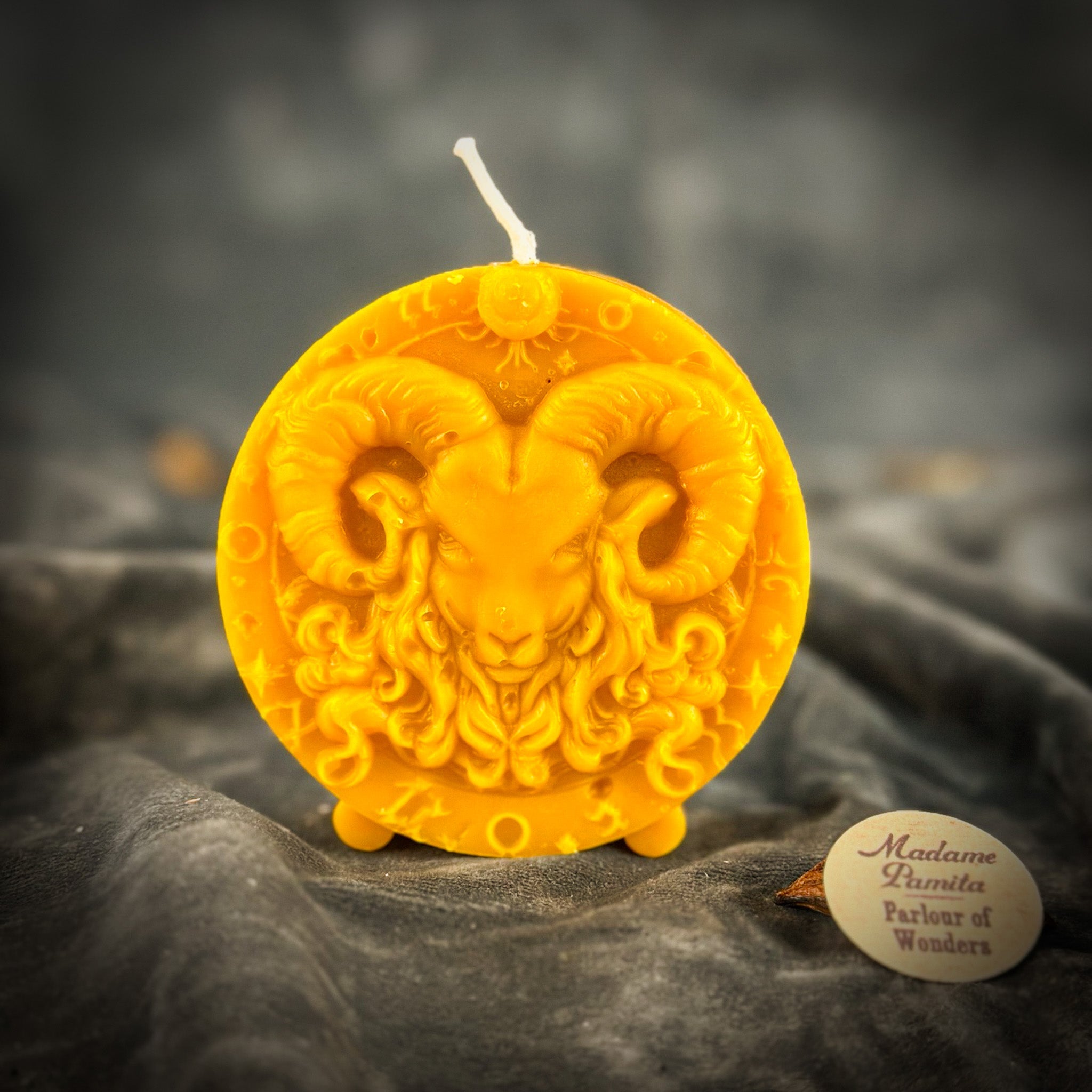 Pink beeswax Aries Ram zodiac spell candle by Parlour of Wonders, featuring detailed ram design for courage, passion, and victory.
