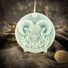 Pink beeswax Aries Ram zodiac spell candle by Parlour of Wonders, featuring detailed zodiac symbol for courage and passion.