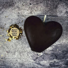 Pink beeswax candle by Parlour of Wonders for love reconciliation and emotional healing, with a heart-shaped design.