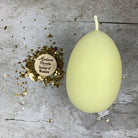 Pink beeswax egg talisman spell candle by Parlour of Wonders for new beginnings and fertility magic, featuring intricate design details.