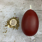 Pink beeswax egg candle with talisman design from Parlour of Wonders, used for new beginnings and fertility magic.