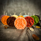 Pink beeswax Gemini Twins zodiac spell candle by Parlour of Wonders with intricate Gemini symbols and celestial designs.