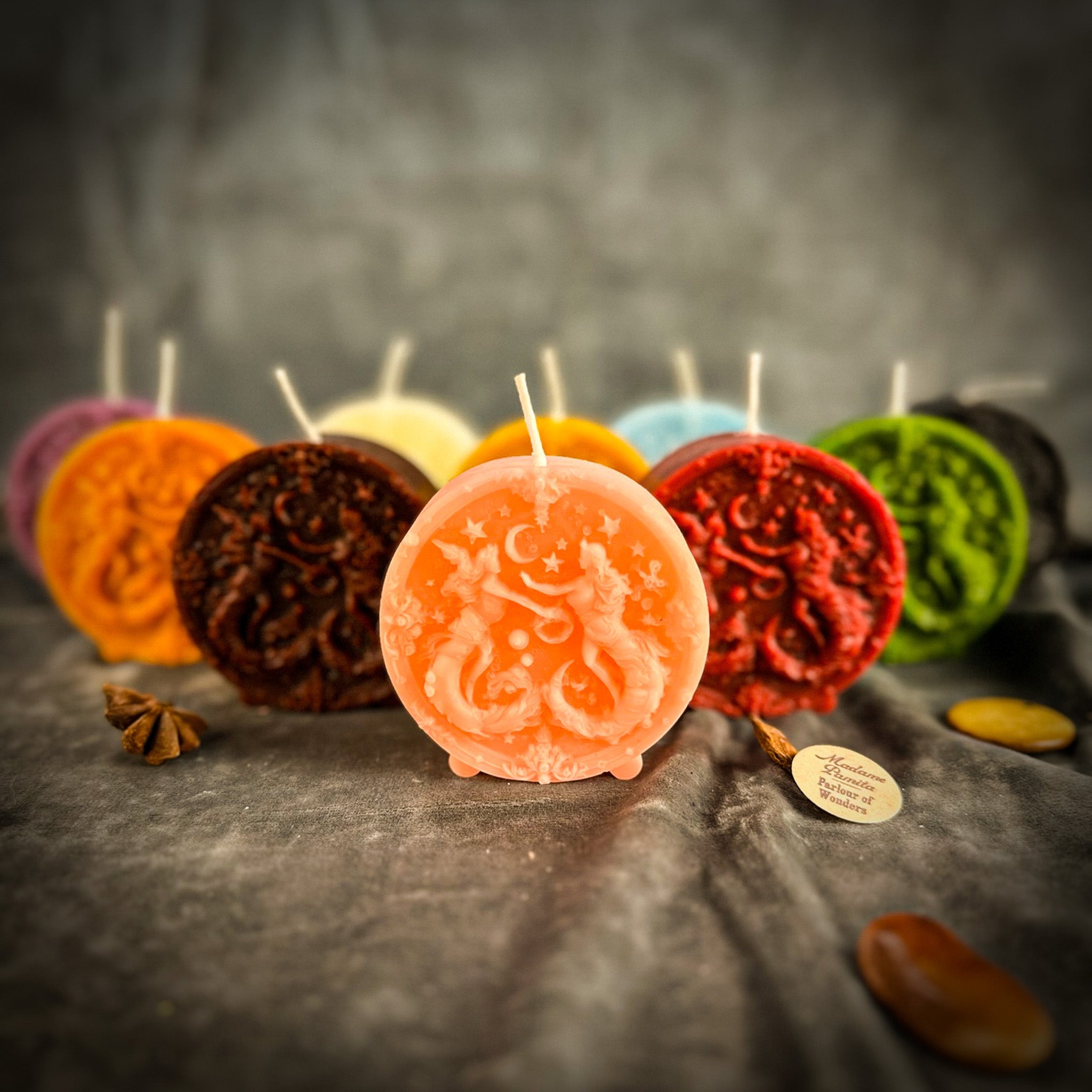 Pink beeswax Gemini Twins zodiac spell candle by Parlour of Wonders with intricate Gemini symbols and celestial designs.
