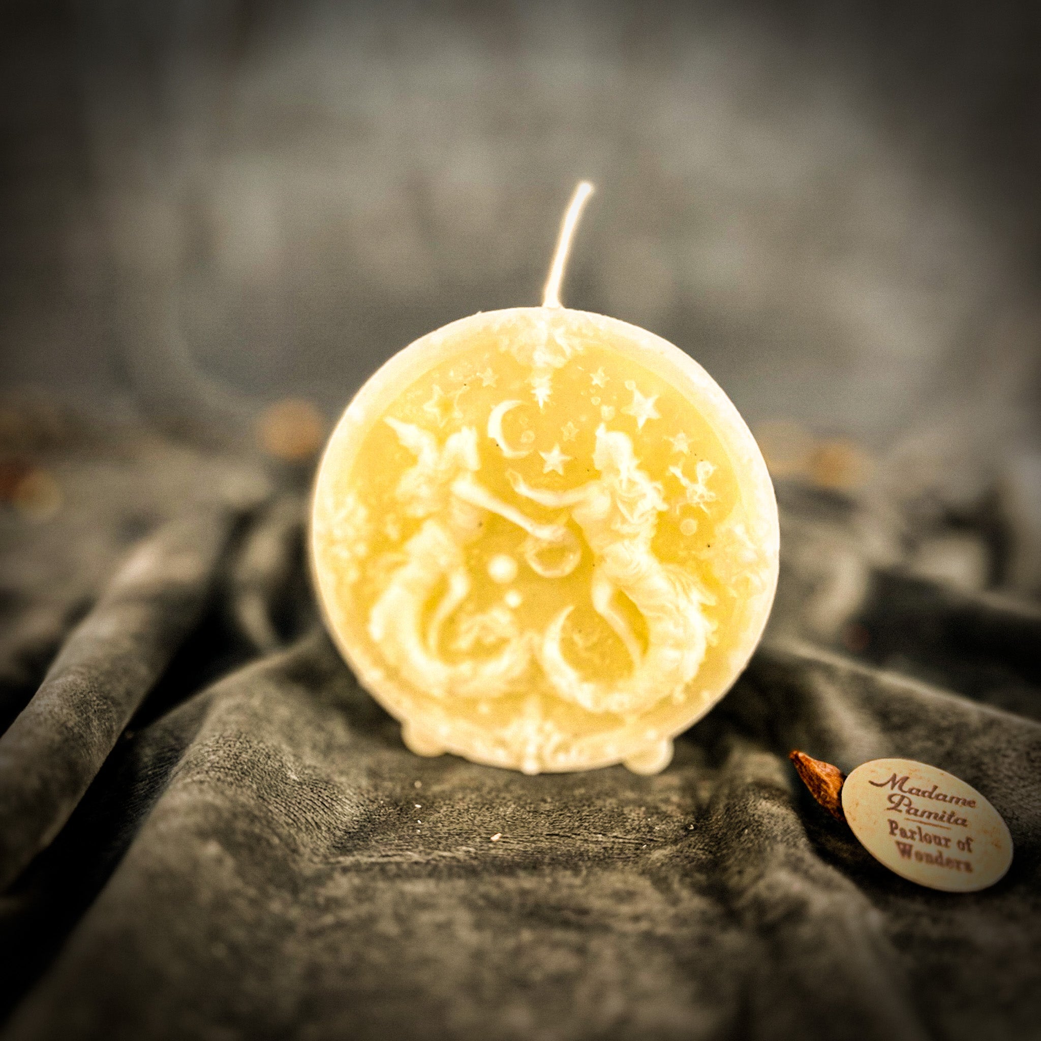 Pink beeswax Gemini Twins zodiac spell candle by Parlour of Wonders, featuring detailed twin symbols for communication and creativity.