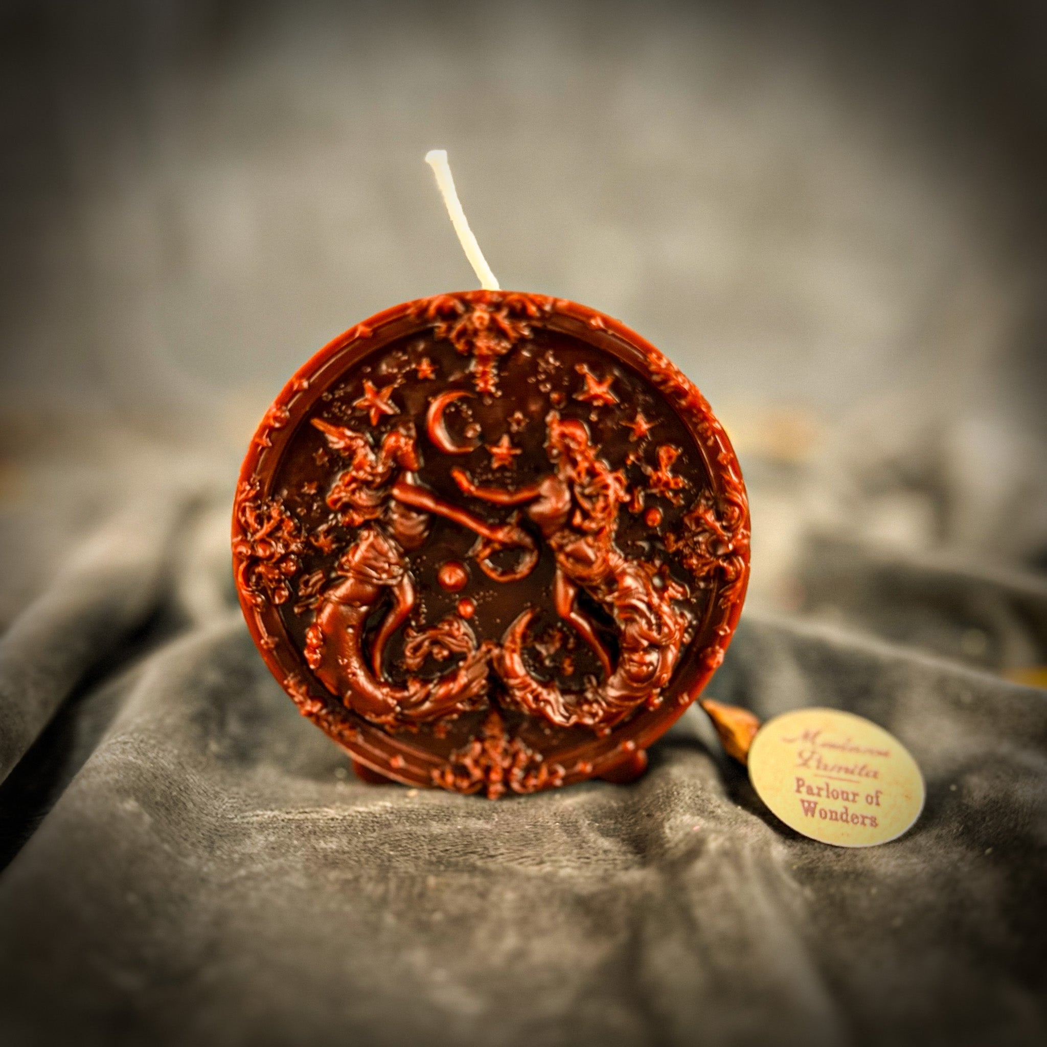 Pink beeswax Gemini Twins zodiac spell candle by Parlour of Wonders, featuring symbols for communication, creativity, and adaptability.