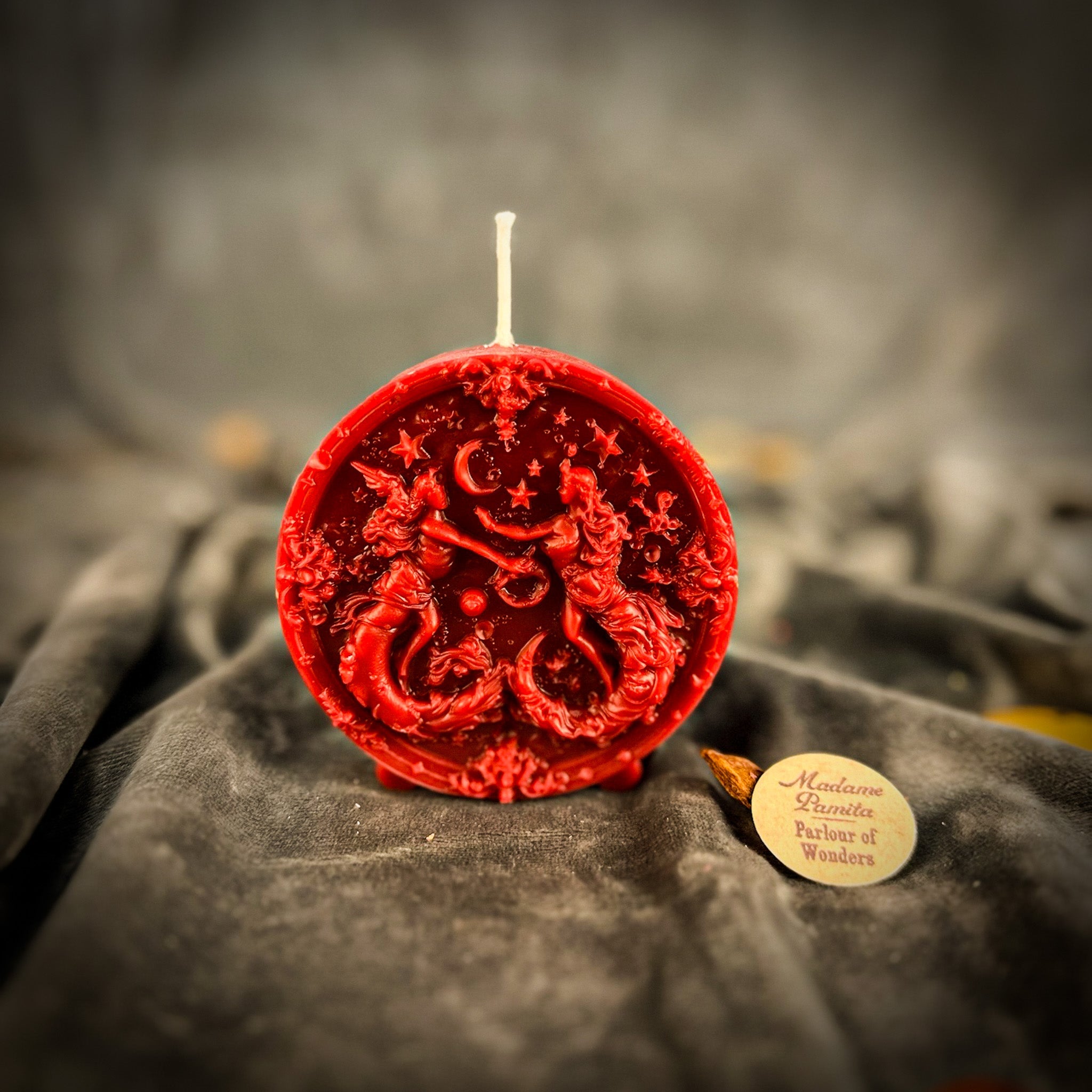 Pink beeswax Gemini Twins zodiac spell candle by Parlour of Wonders, featuring symbols for communication, creativity, and adaptability.