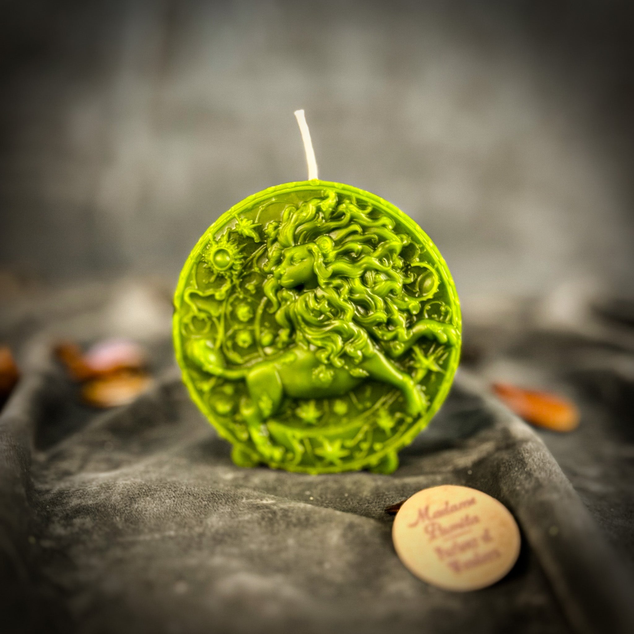Pink beeswax Leo Lion zodiac spell candle by Parlour of Wonders, featuring intricate Leo lion design for creativity and confidence.