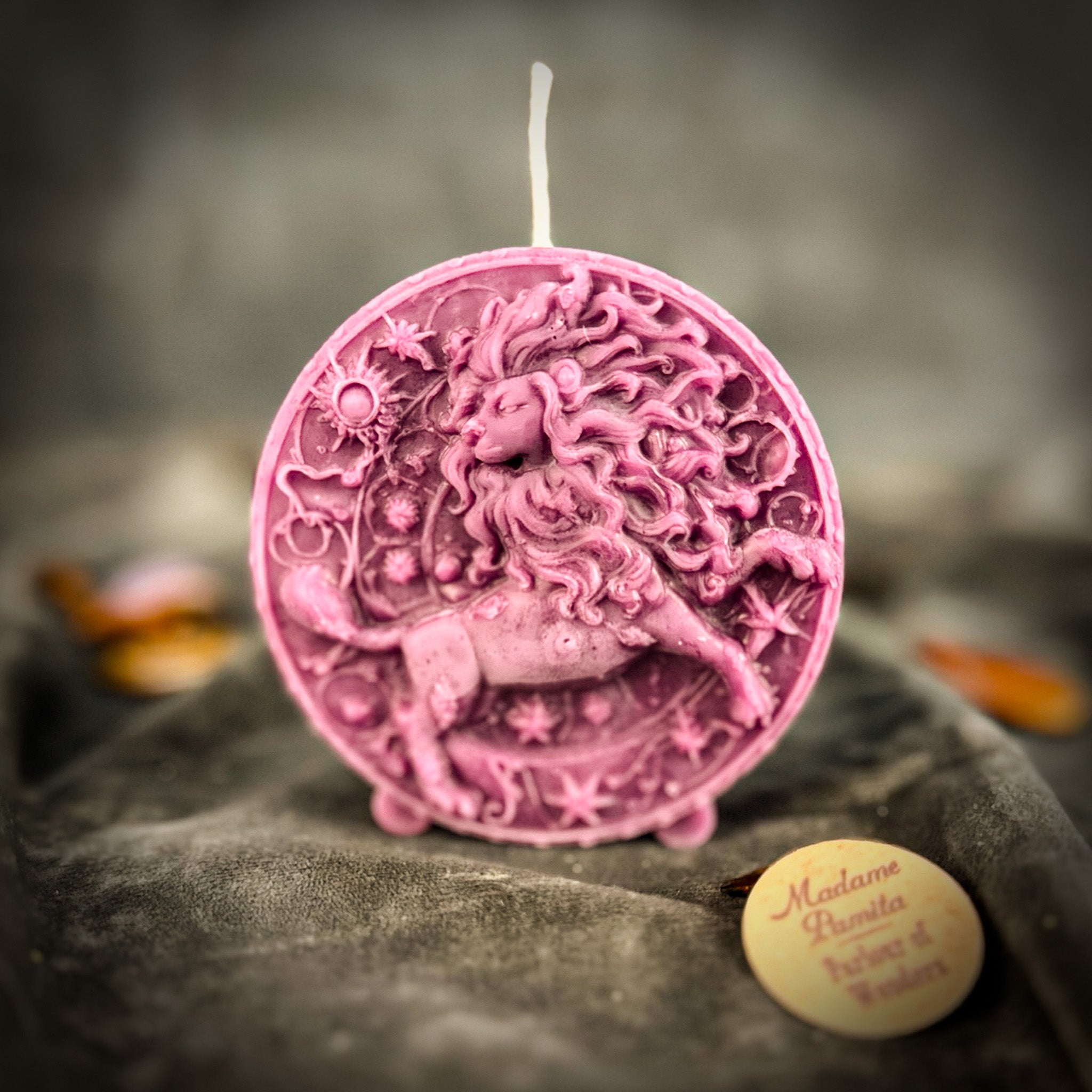 Pink beeswax Leo Lion zodiac spell candle by Parlour of Wonders, designed for creativity, confidence, and leadership.