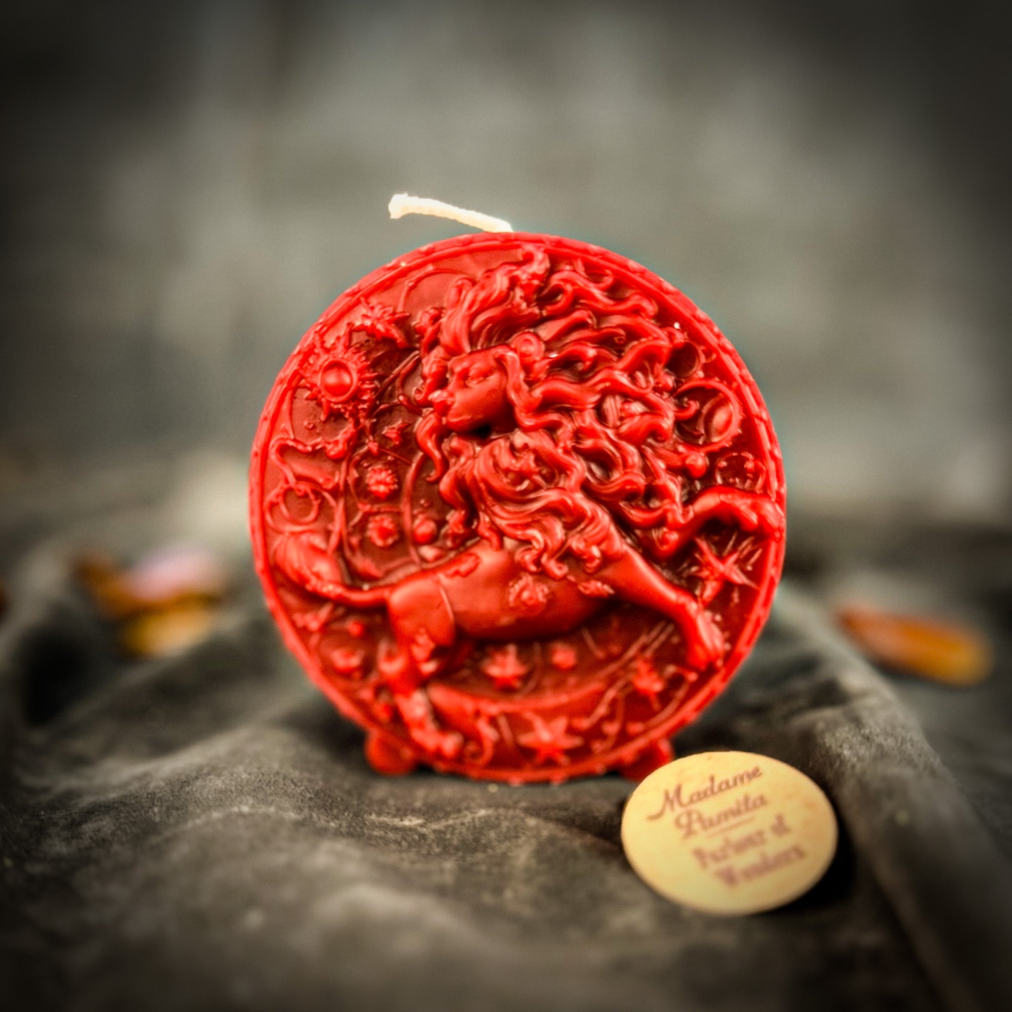 Pink beeswax Leo Lion zodiac spell candle by Parlour of Wonders, featuring detailed lion imagery for creativity, confidence, and leadership.
