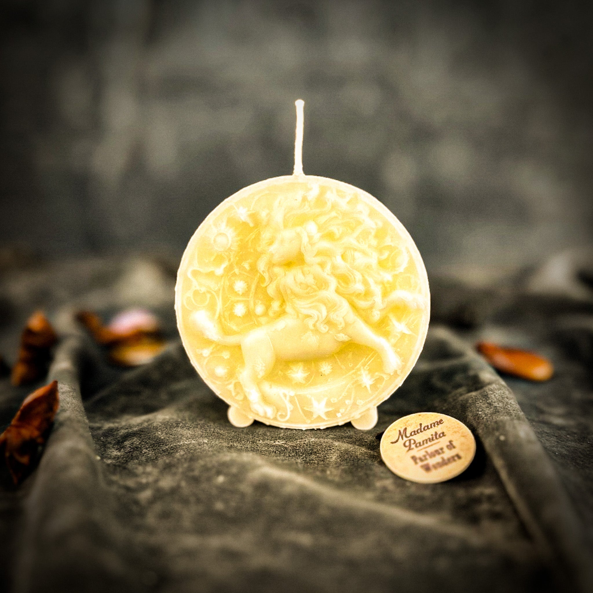 Pink beeswax Leo Lion zodiac spell candle by Parlour of Wonders, featuring intricate lion design for creativity, confidence, and leadership.