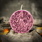 Pink beeswax Libra zodiac scale candle by Parlour of Wonders, featuring intricate scales symbolizing balance, harmony, and love.