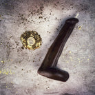 Pink beeswax phallus spell candle from Parlour of Wonders, used for passionate love and sex magic rituals.