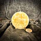 Pink beeswax Taurus Bull zodiac spell candle by Parlour of Wonders, symbolizing abundance, stability, and sensuality.