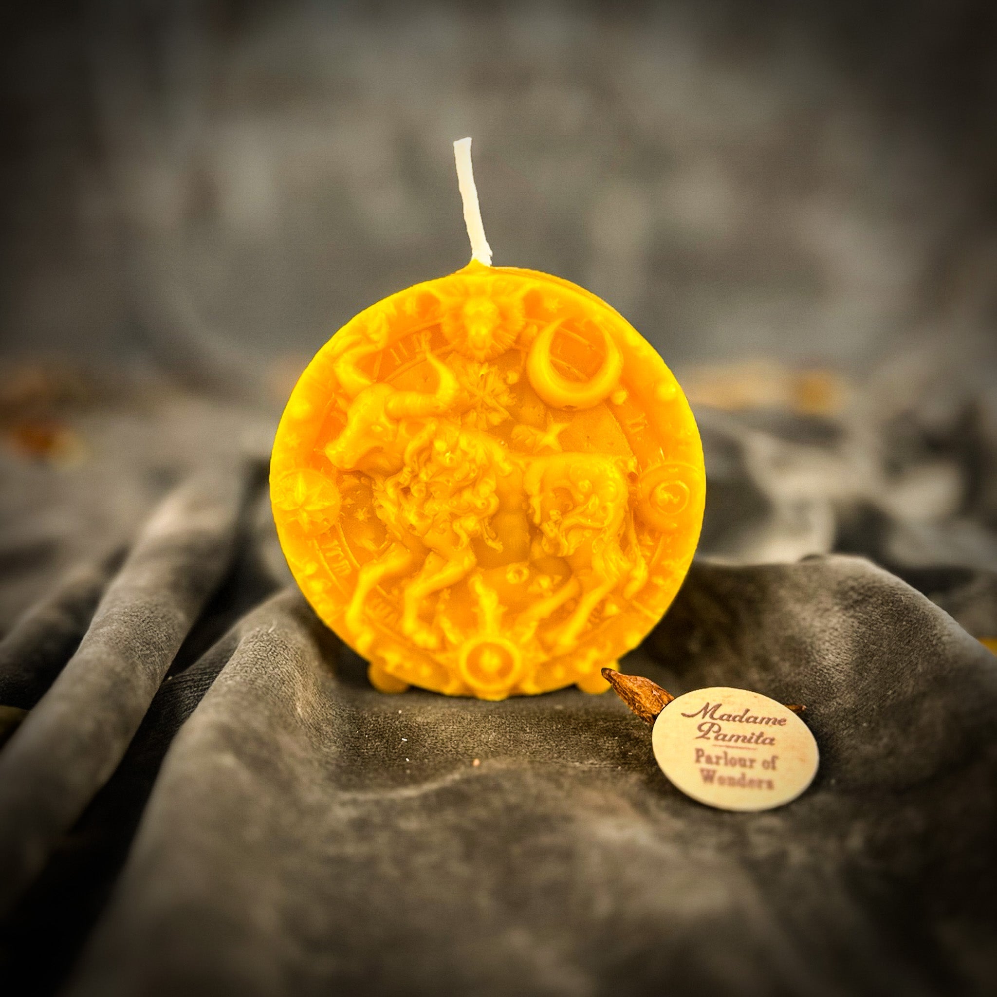 Pink beeswax Taurus Bull zodiac spell candle by Parlour of Wonders, featuring detailed Taurus bull design for abundance and stability.