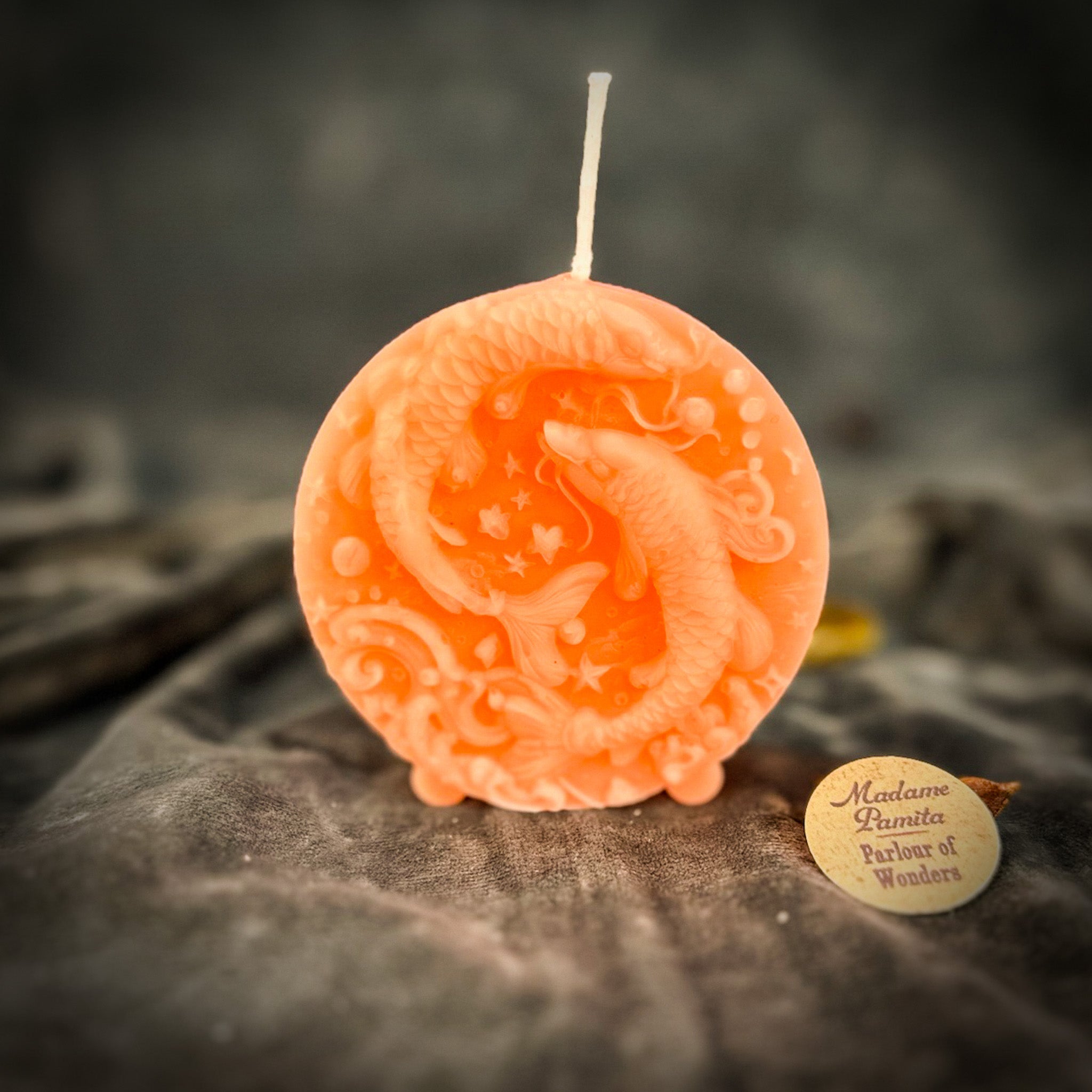 Purple beeswax Pisces fish zodiac spell candle by Parlour of Wonders, featuring intricate fish design for intuition and dreams.