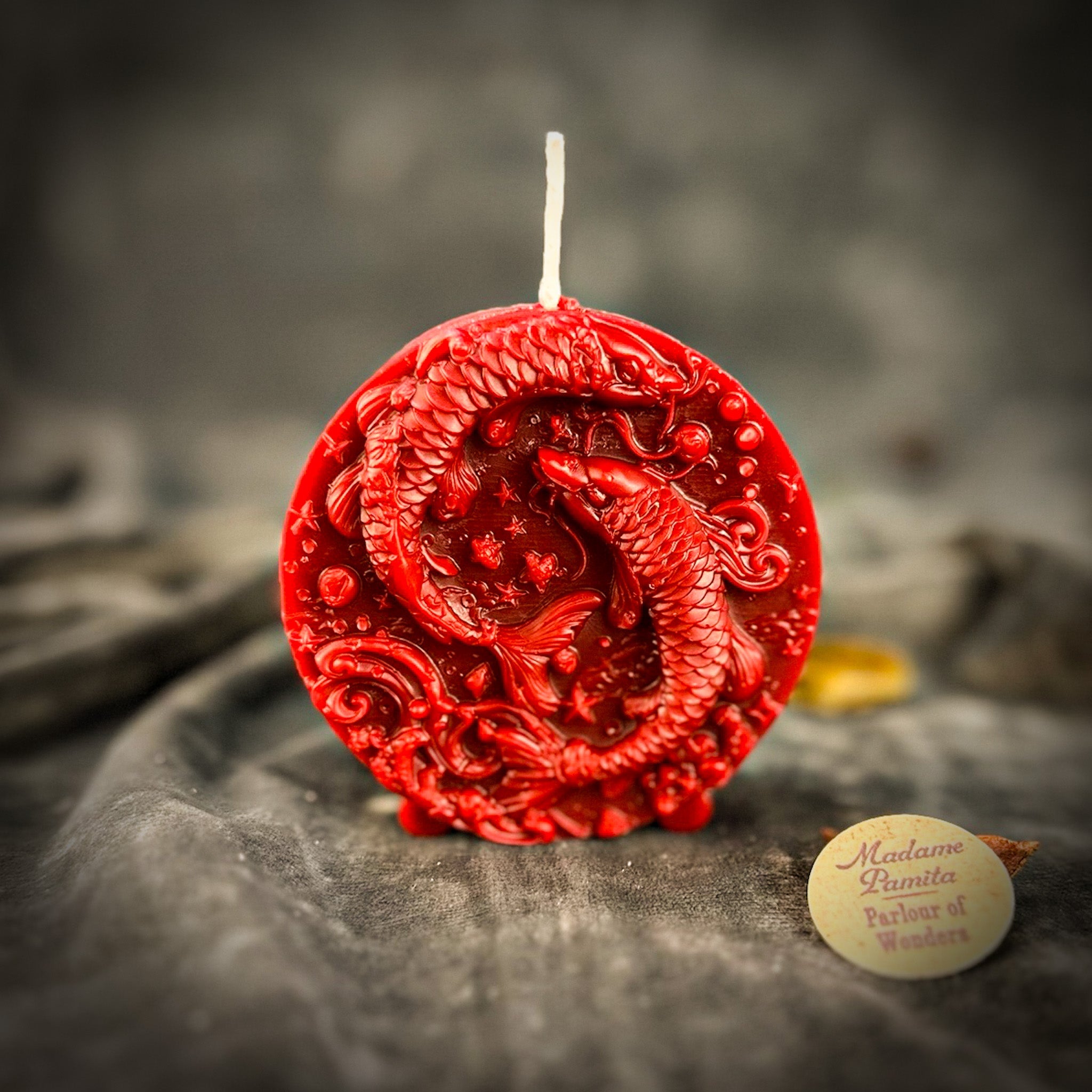 Purple beeswax candle featuring a Pisces fish zodiac symbol, used for intuition, compassion, and dreams, by Parlour of Wonders.