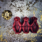 Beeswax Three Wise Monkeys Spell Candle by Parlour of Wonders, featuring red wax and intricate monkey design for magic and protection.