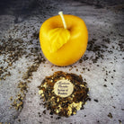 Red beeswax Apple of Avalon spell candle by Parlour of Wonders, featuring intricate details for love and abundance magic.
